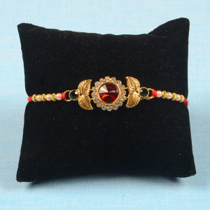 Red Gemstone Rakhi with Golden Leaf